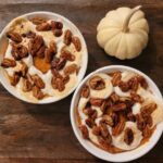 sweet potato casserole topped with vegan marshmallows and maple pecans